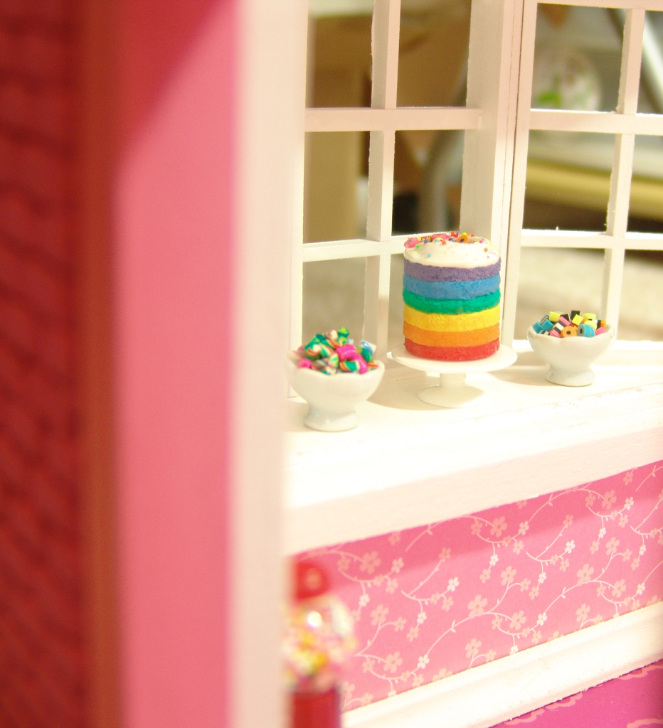 Peeking through the door of the miniature bakery